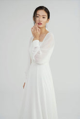 Elegant long-sleeve organza dress with square neckline and delicate textured bodice